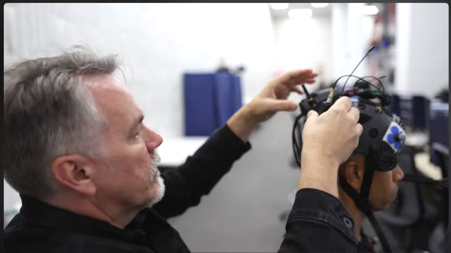 Kyle Johnson fitting a lav mic on the mocap stage